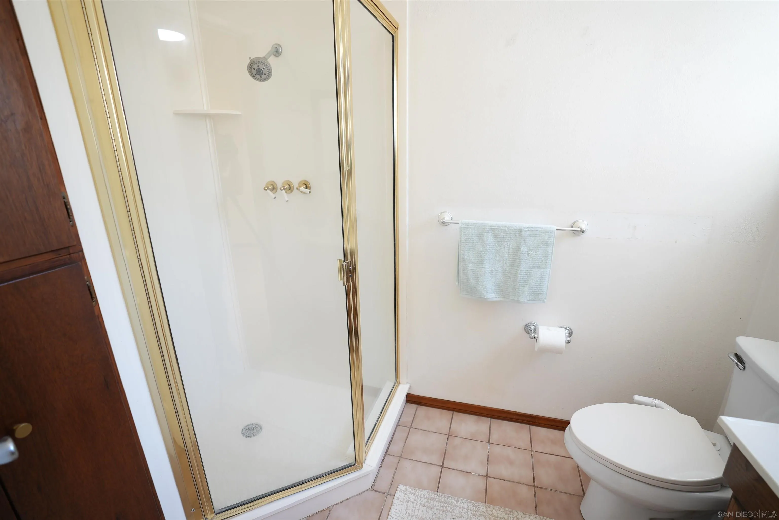7902 Poplin Drive Santee, CA 92071 - Photo 42 of 59 a bathroom with a granite countertop shower and a toilet