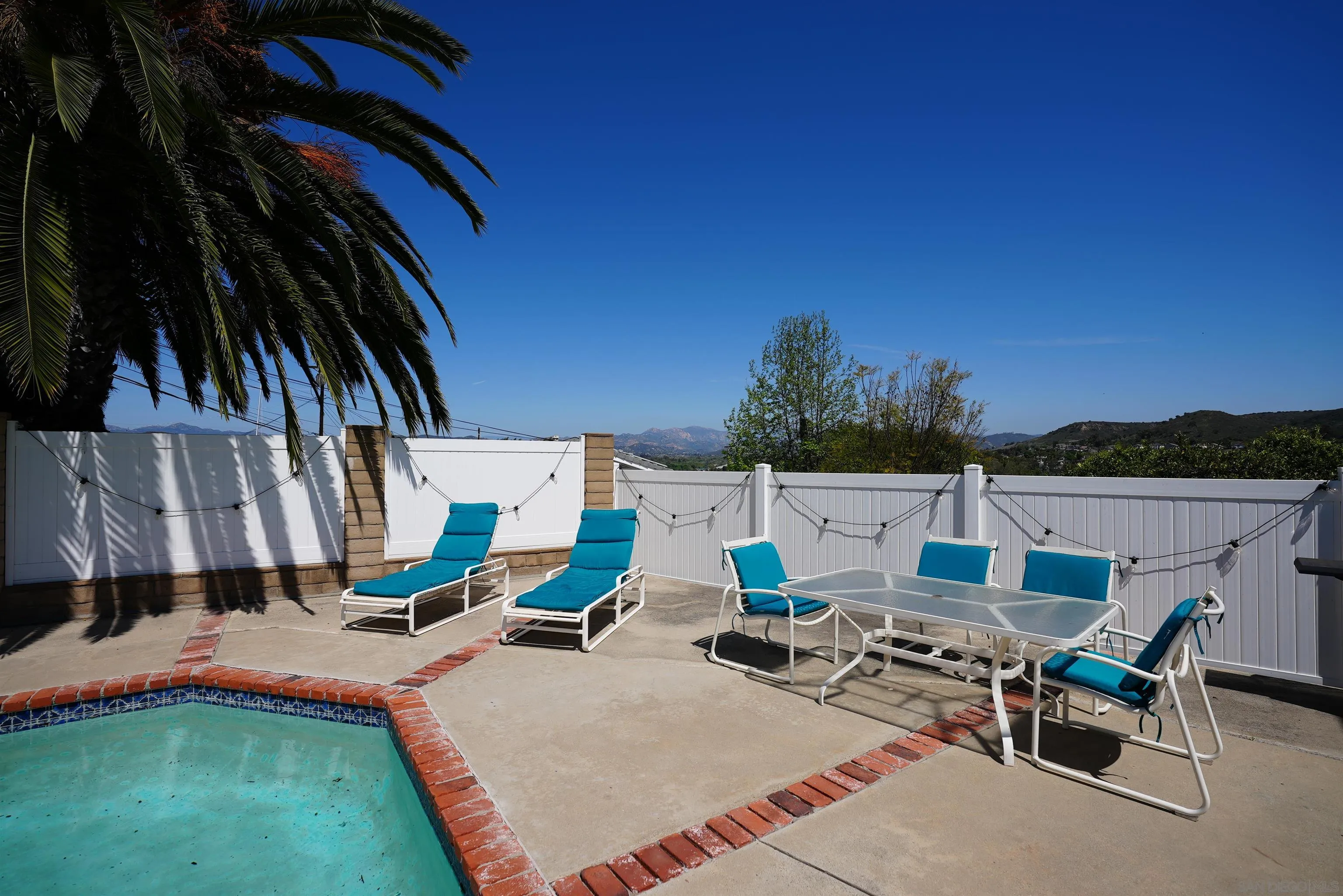 7902 Poplin Drive Santee, CA 92071 - Photo 48 of 59 a view of a patio with a table and chairs