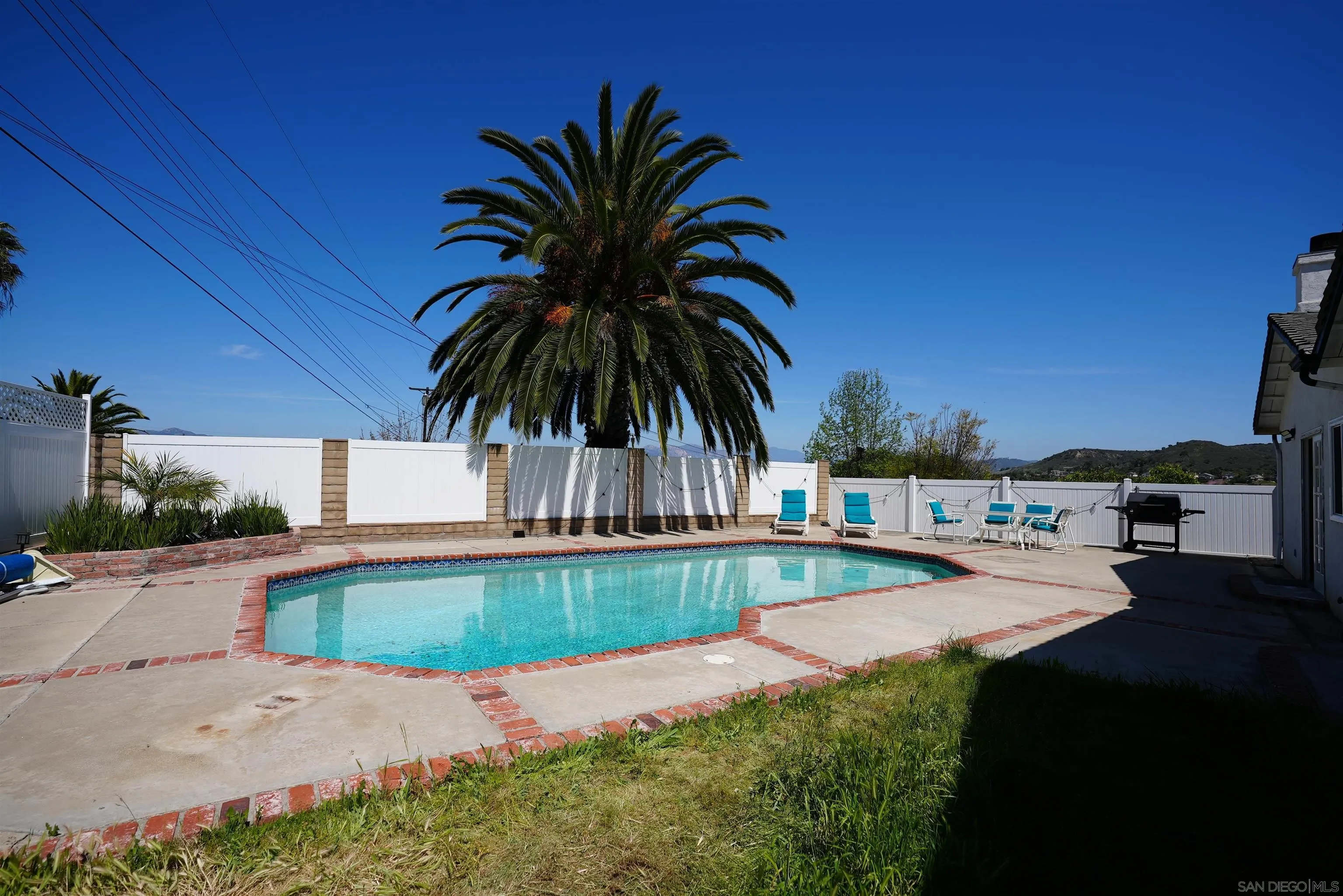 7902 Poplin Drive Santee, CA 92071 - Photo 52 of 59 a view of a backyard with plants and swimming pool