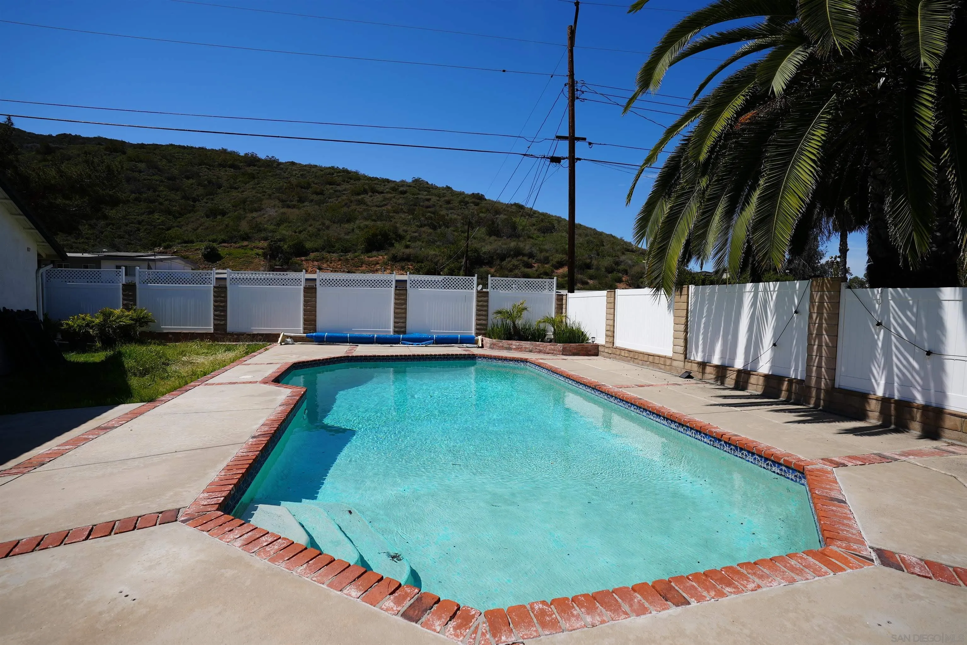 7902 Poplin Drive Santee, CA 92071 - Photo 53 of 59 a view of a swimming pool with a yard