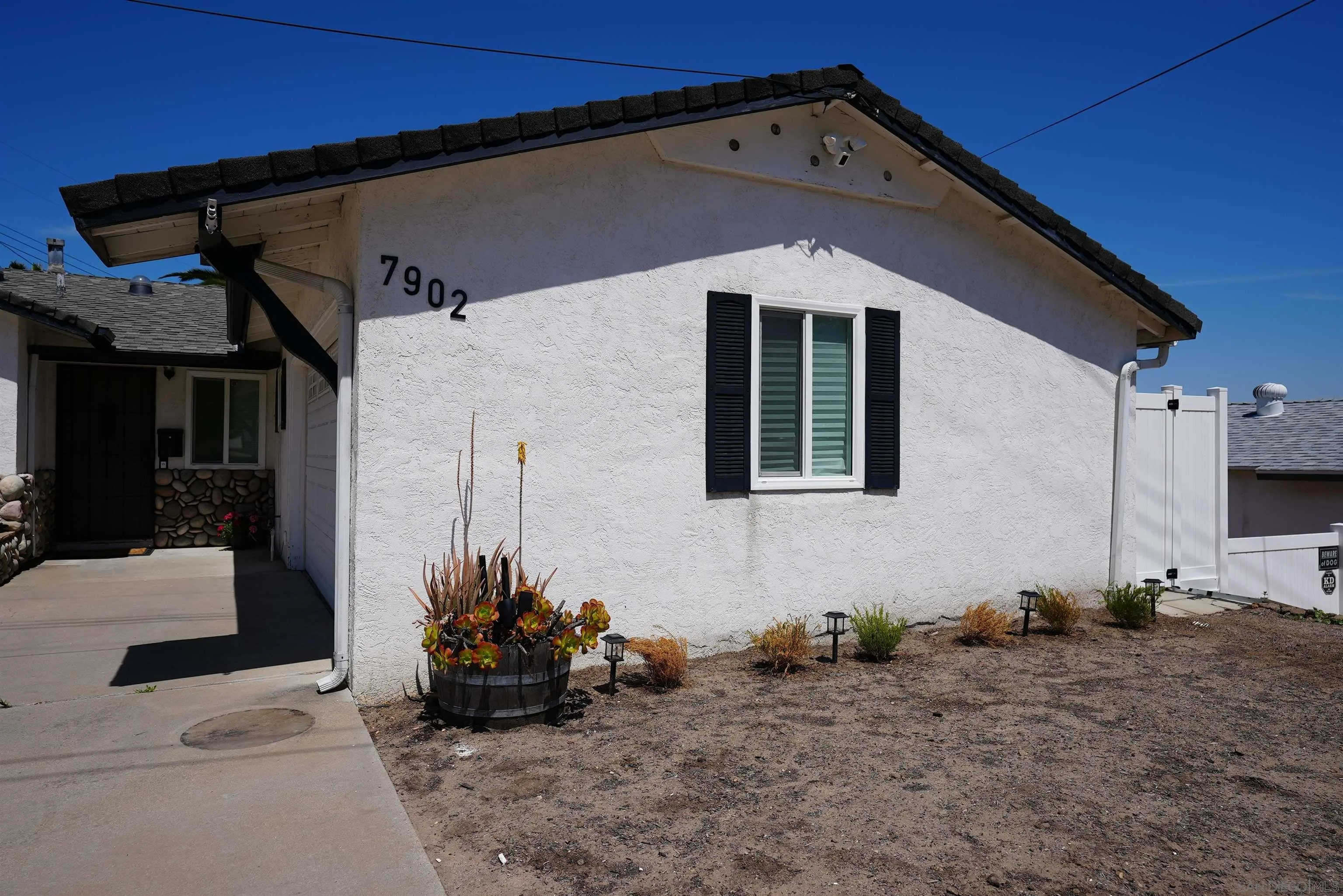 7902 Poplin Drive Santee, CA 92071 - Photo 6 of 59 a front view of a house