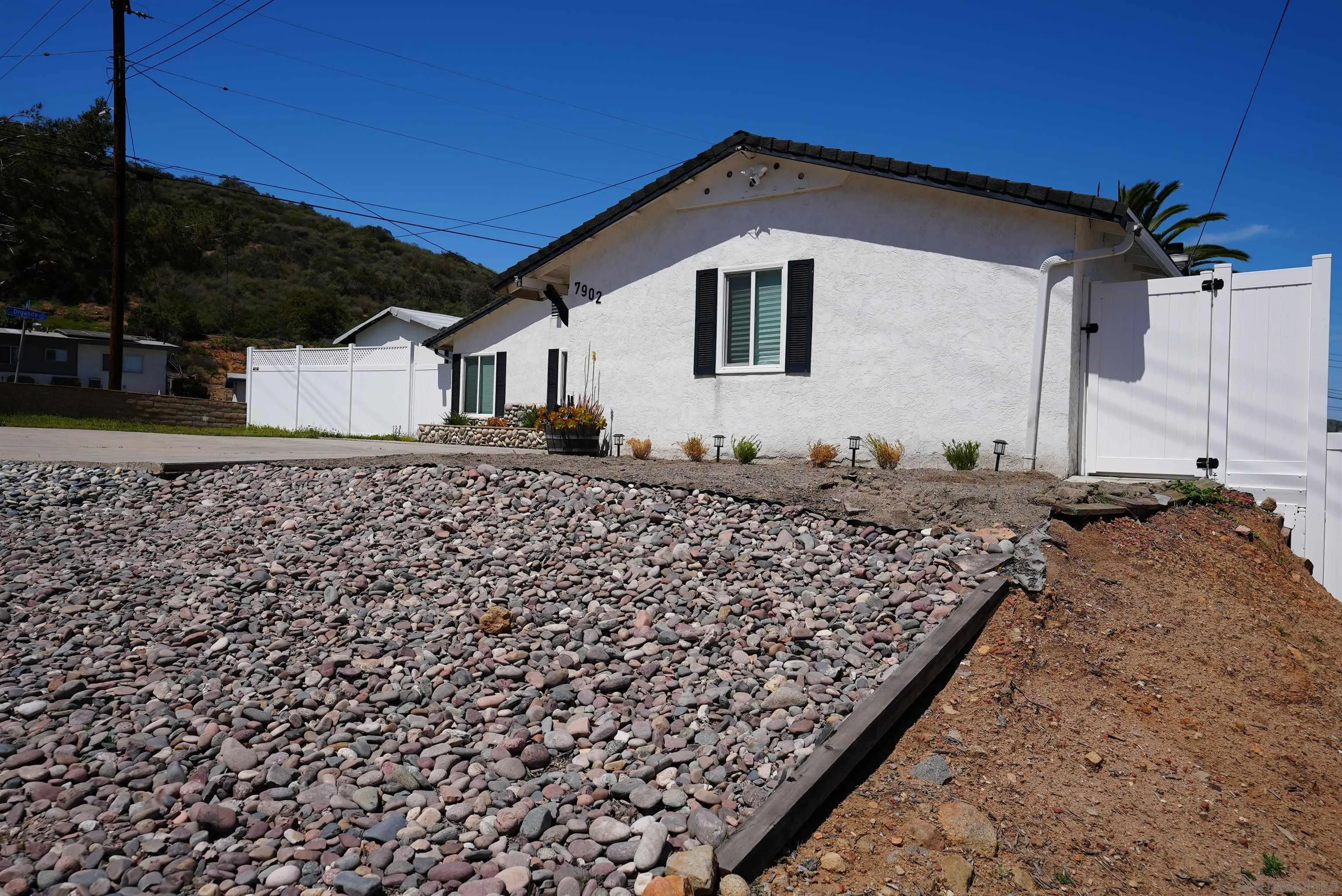 7902 Poplin Drive Santee, CA 92071 - Photo 7 of 59 a front view of a house with a yard
