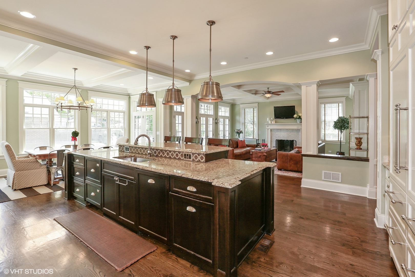615 Courtland Avenue Park Ridge, IL 60068 - Photo 6 of 29 a large kitchen with kitchen island a sink a stove and a large window