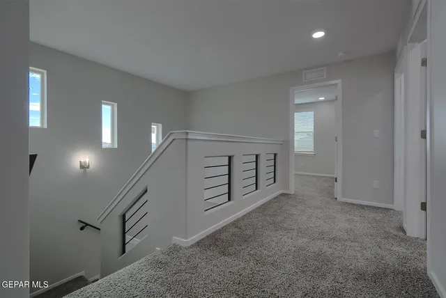 a view of a kitchen with a sink and chandelier