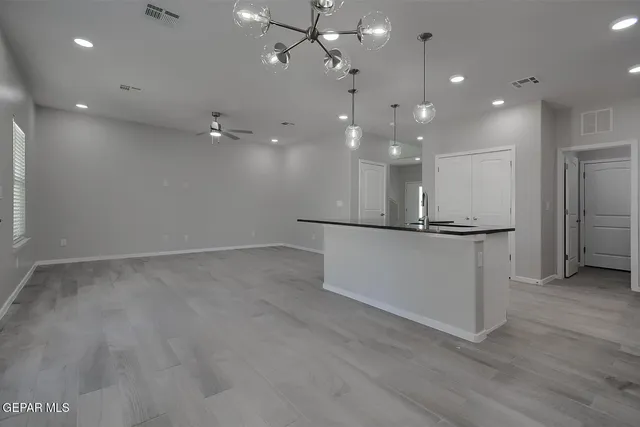 a bathroom with double sink and a large mirror