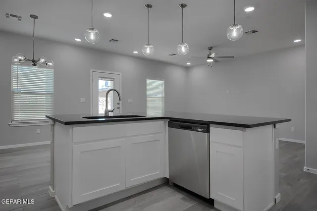 a view of a double sink and a window