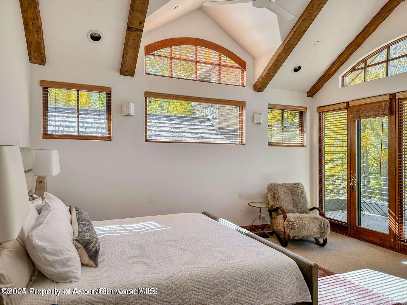 1540 Silver King Drive Aspen, CO 81611 - Photo 14 of 32 a bedroom with a bed and wooden floor