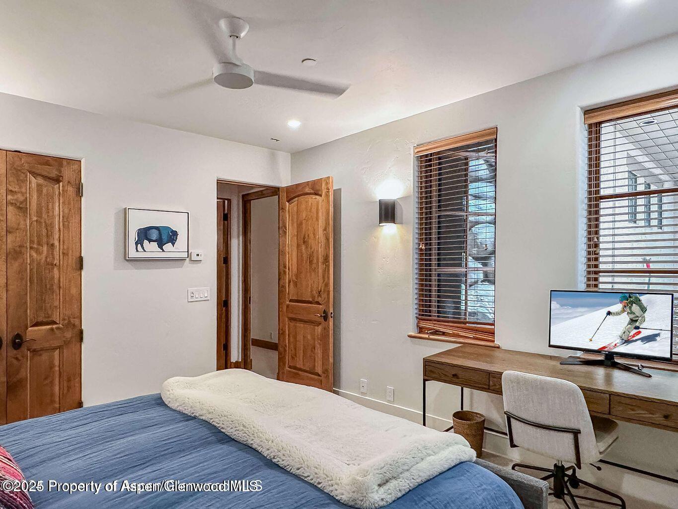 1540 Silver King Drive Aspen, CO 81611 - Photo 21 of 32 a bedroom with a bed and a desk