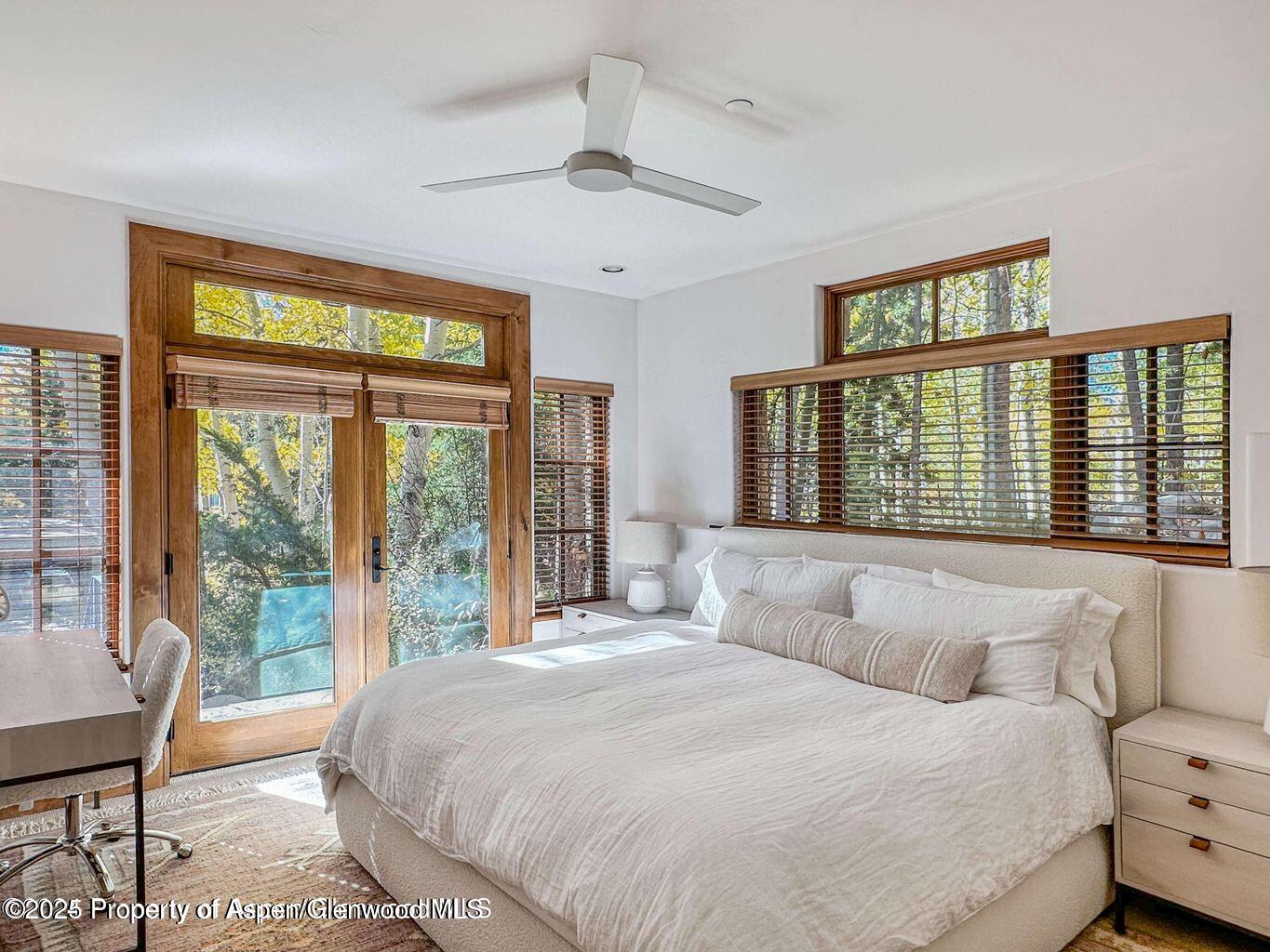 1540 Silver King Drive Aspen, CO 81611 - Photo 23 of 32 a bedroom with a large bed and a large window