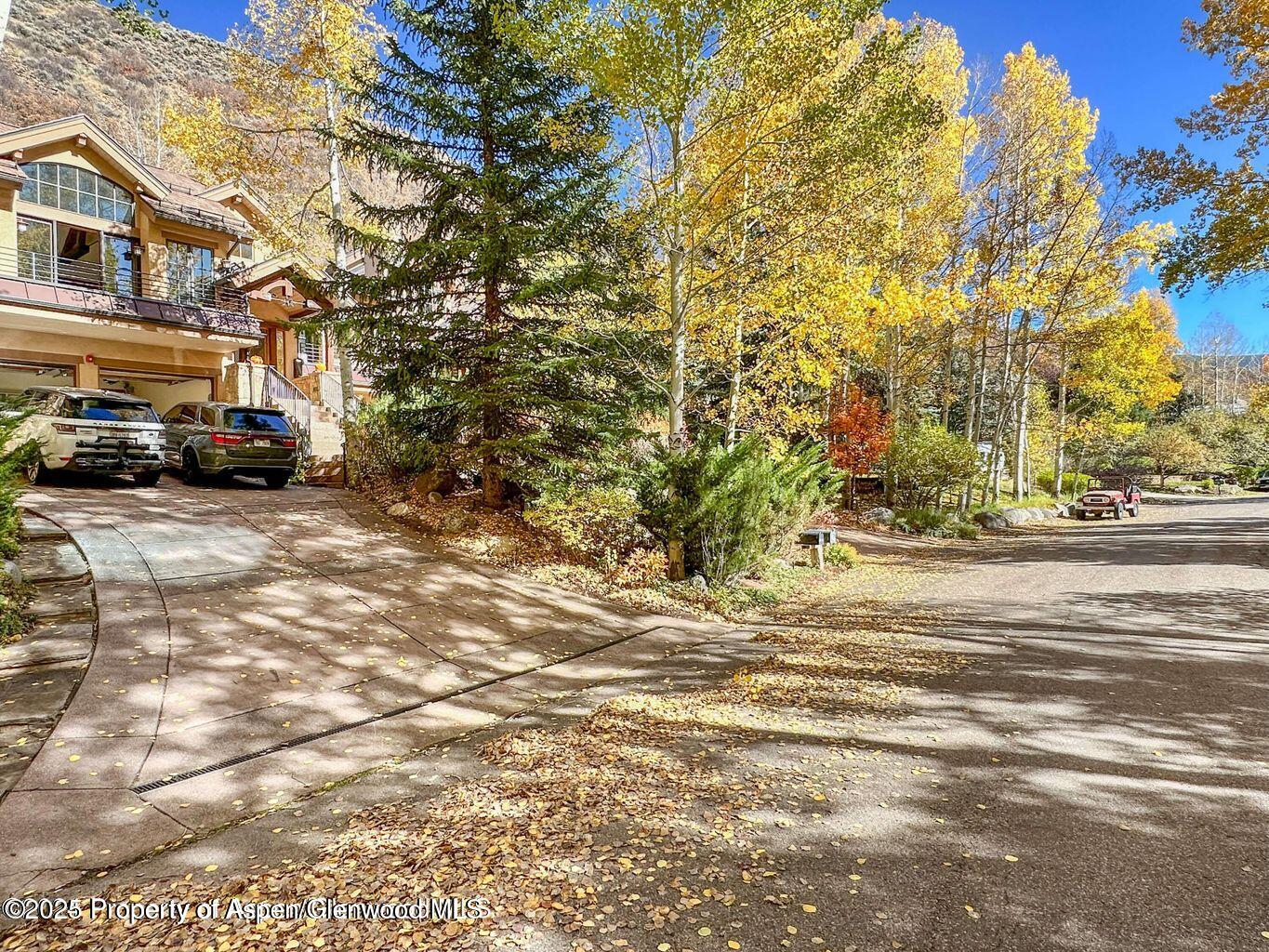 1540 Silver King Drive Aspen, CO 81611 - Photo 30 of 32 a view of a street with a building in the background