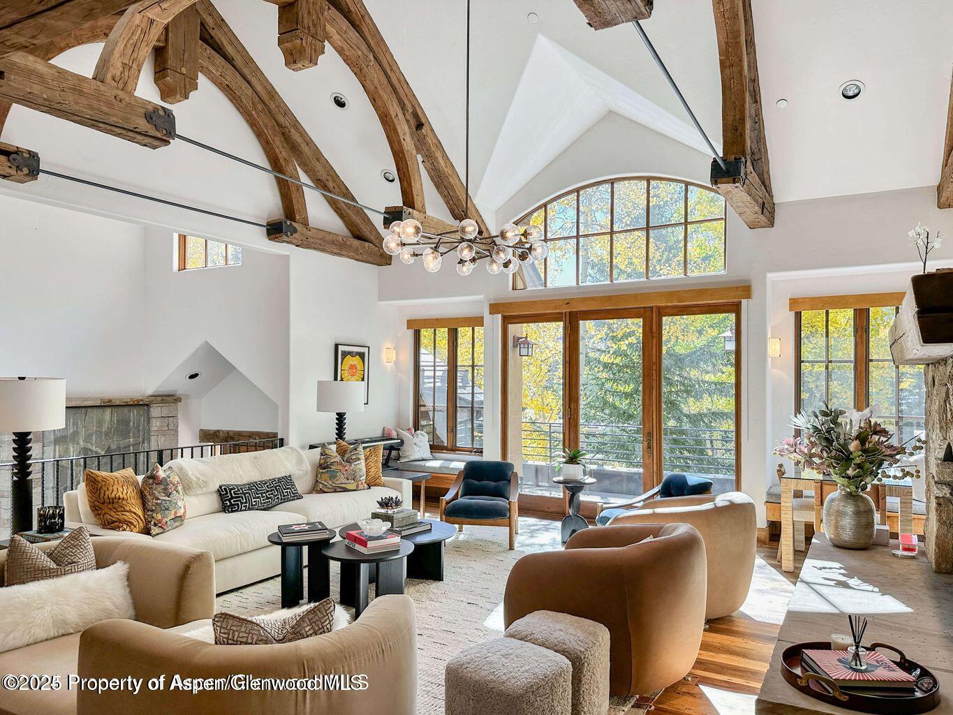 1540 Silver King Drive Aspen, CO 81611 - Photo 6 of 32 a living room with fireplace furniture and a large window