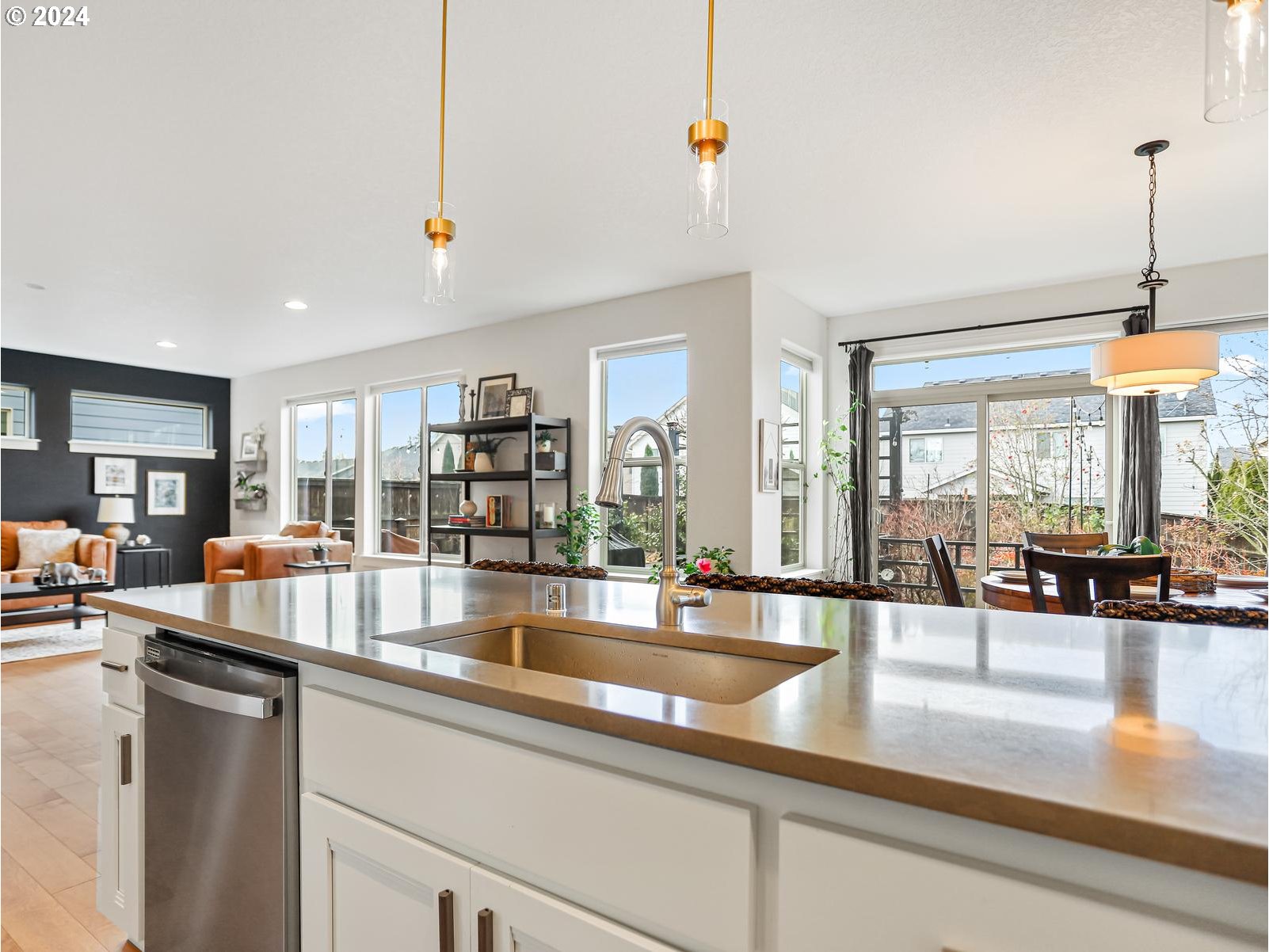 139 North 39th Court Ridgefield, WA 98642 - Photo 13 of 45 a large kitchen with stainless steel appliances granite countertop a lot of counter space and a living room