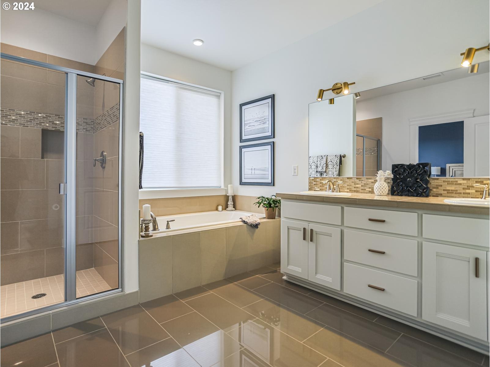 139 North 39th Court Ridgefield, WA 98642 - Photo 28 of 45 a spacious bathroom with a double vanity sink a large mirror and shower