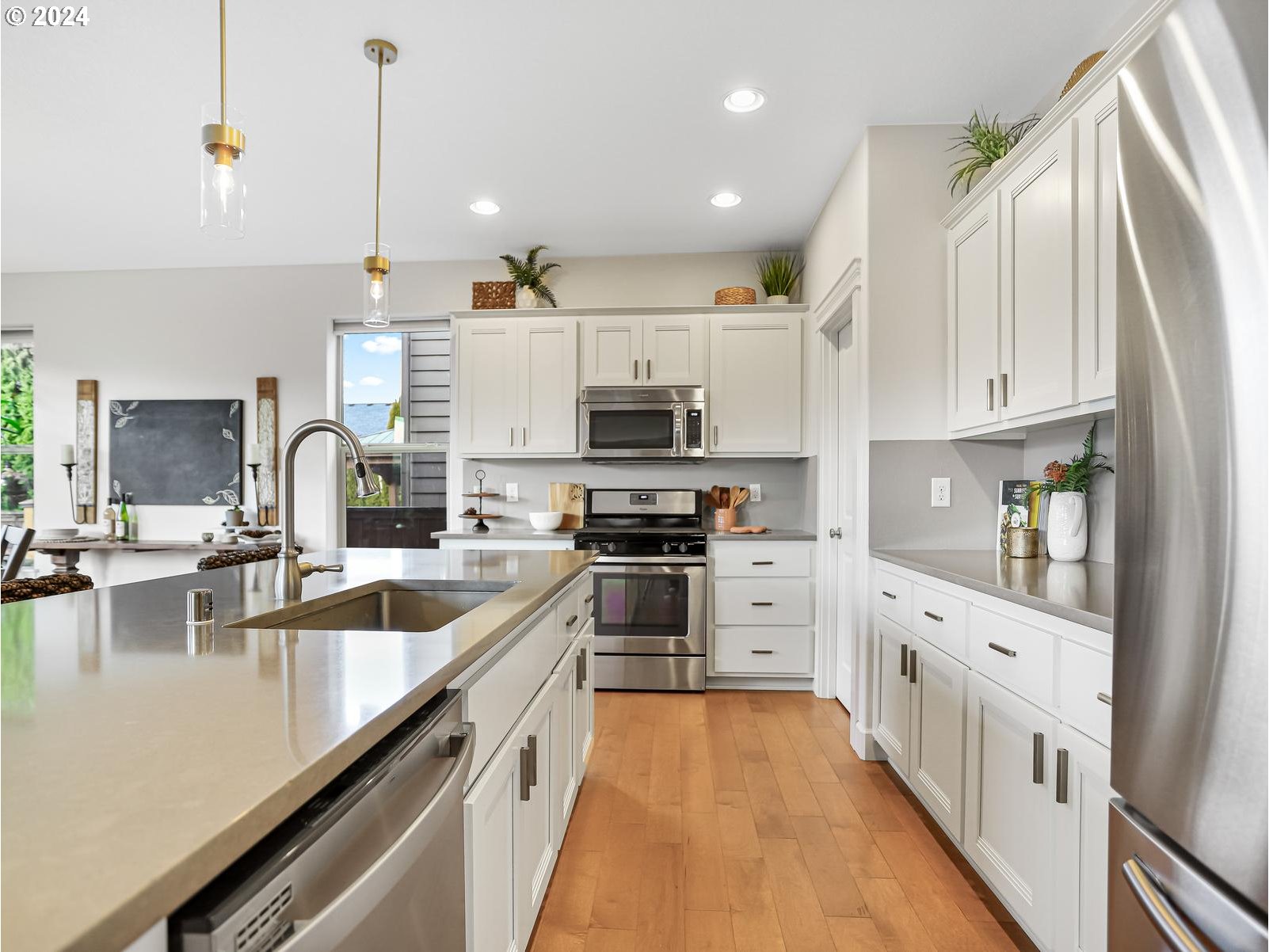 139 North 39th Court Ridgefield, WA 98642 - Photo 8 of 45 a kitchen with stainless steel appliances a stove top oven a sink a counter space and cabinets