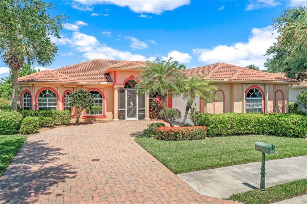 3972 Ruxton Road Naples, FL 34116 - Photo 1 of 1 a front view of a house with a yard