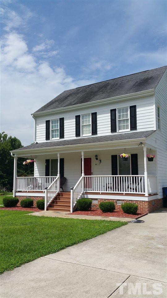 4401 Wolftrap Road Raleigh, NC 27616 - Photo 2 of 18 a front view of a house with a yard