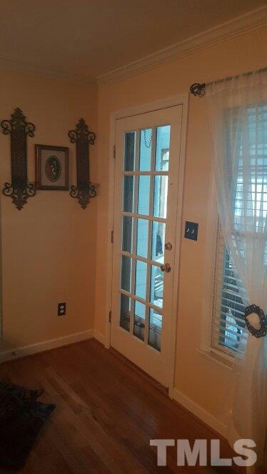 4401 Wolftrap Road Raleigh, NC 27616 - Photo 13 of 18 a view of a room with wooden floor and windows