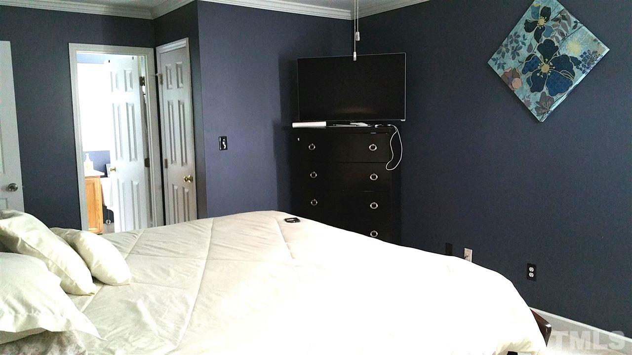 4401 Wolftrap Road Raleigh, NC 27616 - Photo 16 of 18 a bed room with a bed