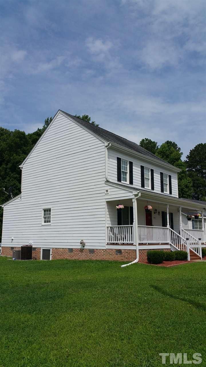 4401 Wolftrap Road Raleigh, NC 27616 - Photo 17 of 18 a front view of a house with a garden