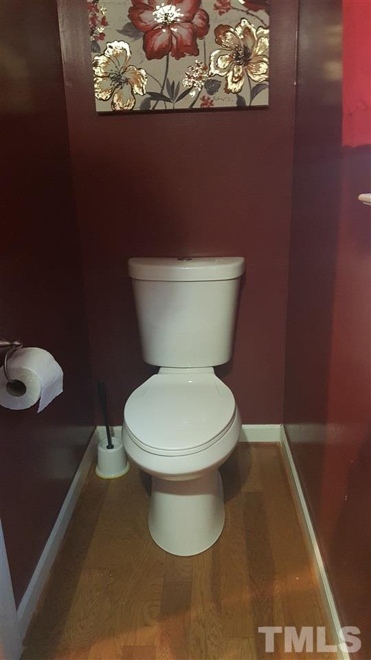 4401 Wolftrap Road Raleigh, NC 27616 - Photo 9 of 18 a white toilet sitting next to a shower