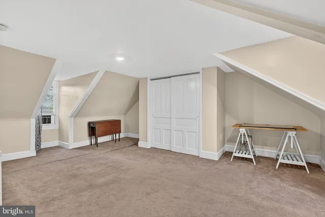 a view of an empty room with a fireplace