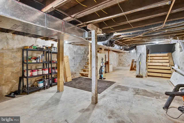 a view of a brick house with many windows