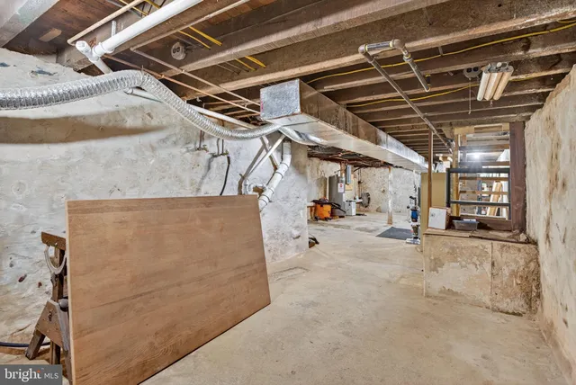 a view of a backyard with wooden fence