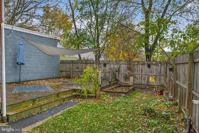 a view of a backyard with sitting area