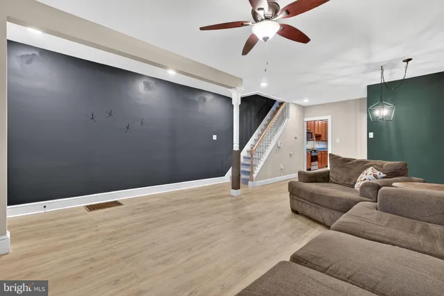 a living room with furniture and window