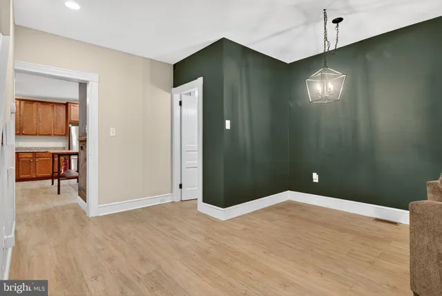 a spacious bathroom with a double vanity sink toilet and shower