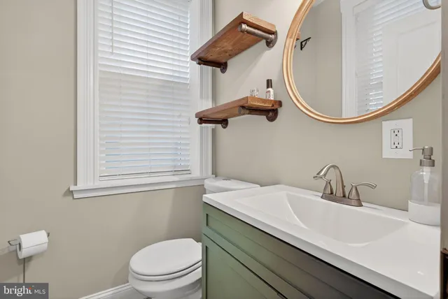 a kitchen with stainless steel appliances granite countertop a stove top oven a sink dishwasher and cabinets with wooden floor