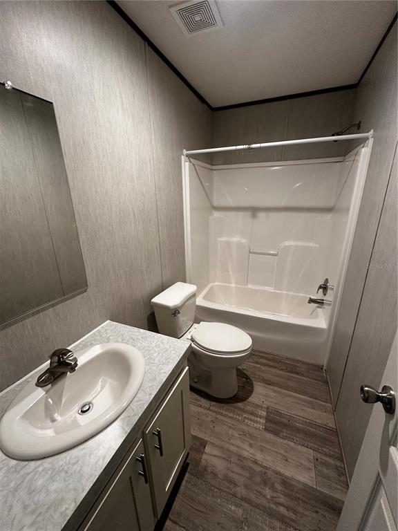 3060 Southeast 48th Street Ocala, FL 34480 - Photo 5 of 10 a bathroom with a sink mirror vanity and toilet