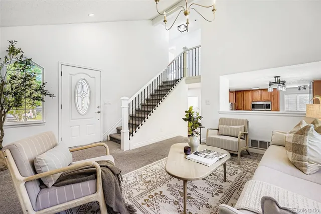 a living room with furniture and a table