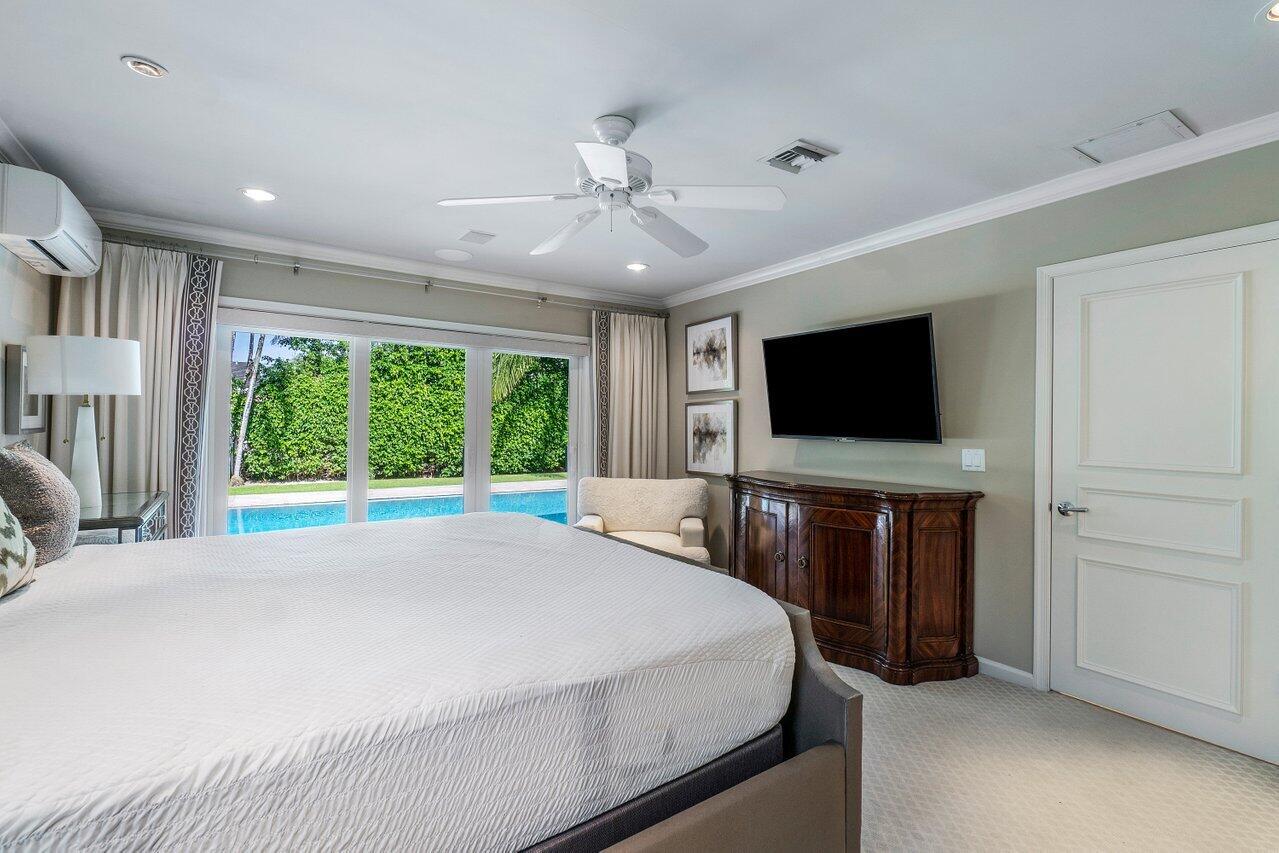 2377 East Silver Palm Road Boca Raton, FL 33432 - Photo 10 of 40 a bedroom with a bed and a flat screen tv