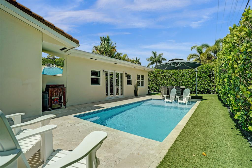 2185 Northeast 61st Court Fort Lauderdale, FL 33308 - Photo 17 of 49 a view of a house with backyard porch and sitting area