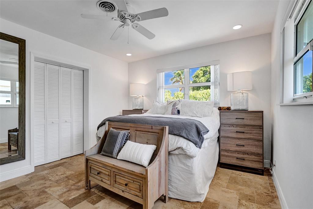 2185 Northeast 61st Court Fort Lauderdale, FL 33308 - Photo 19 of 49 a room with a bed and a dresser