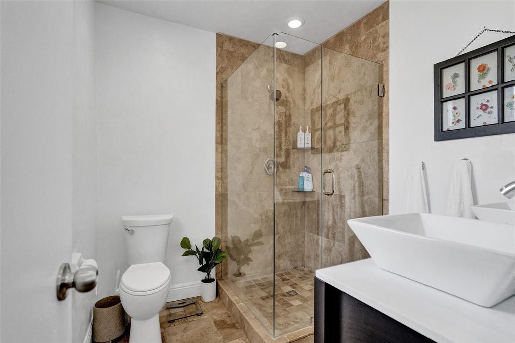 2185 Northeast 61st Court Fort Lauderdale, FL 33308 - Photo 21 of 49 a bathroom with a sink toilet and shower