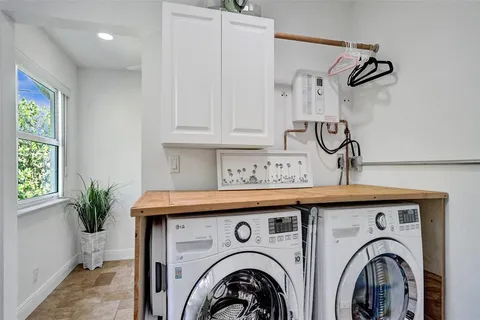 a room with a window and a flat screen tv