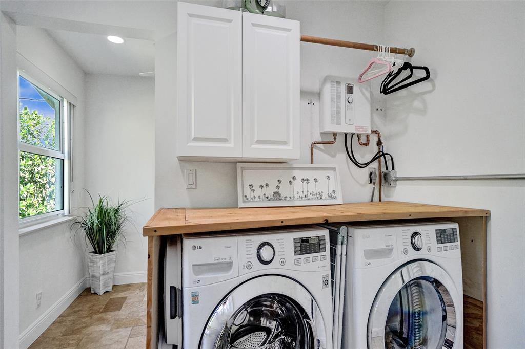 2185 Northeast 61st Court Fort Lauderdale, FL 33308 - Photo 25 of 49 a utility room with dryer and washer