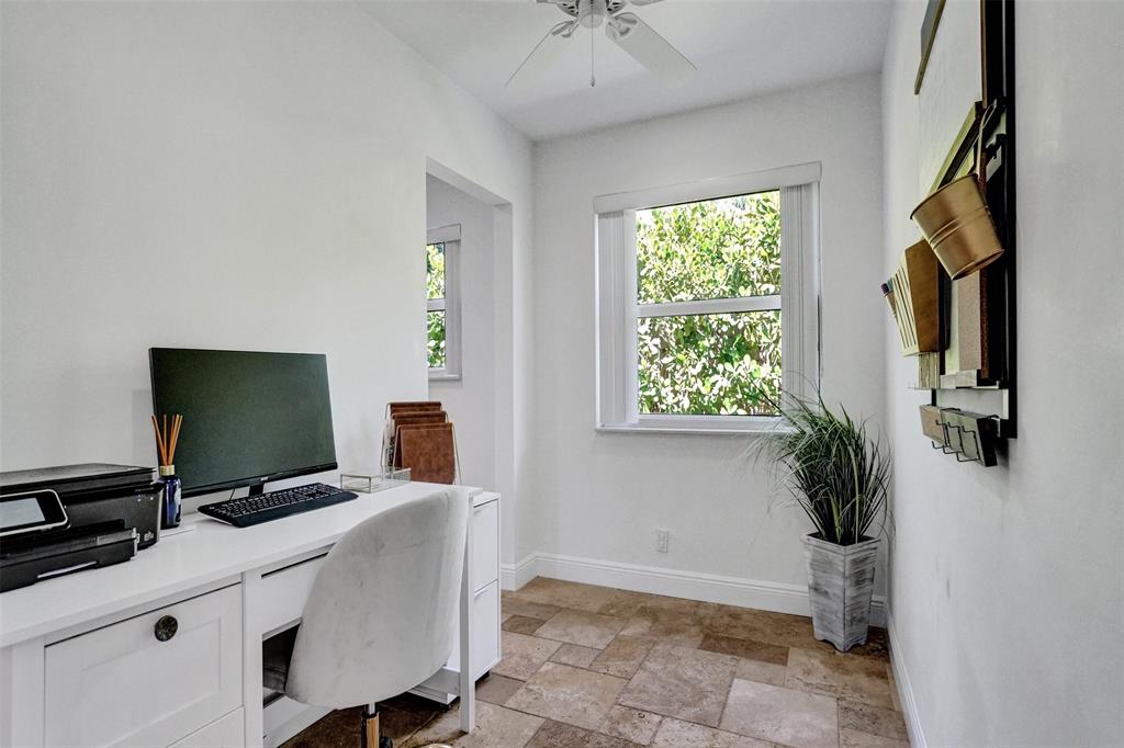2185 Northeast 61st Court Fort Lauderdale, FL 33308 - Photo 26 of 49 a room with a window and a flat screen tv
