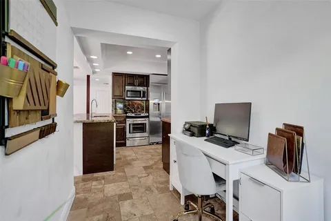 a bedroom with furniture and window