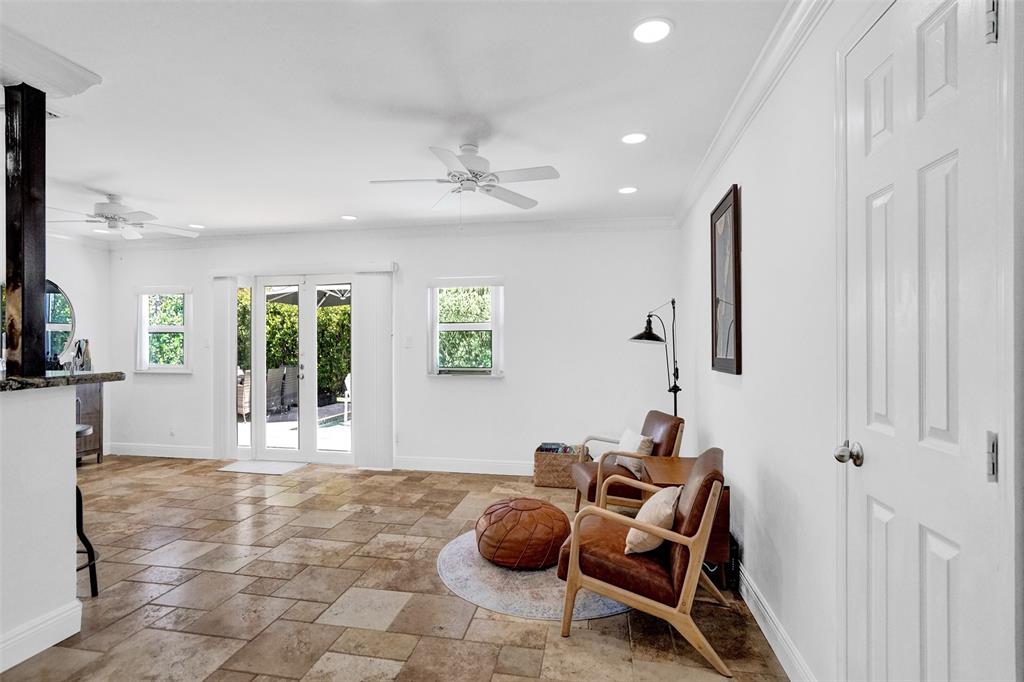 2185 Northeast 61st Court Fort Lauderdale, FL 33308 - Photo 29 of 49 a room with furniture and a table