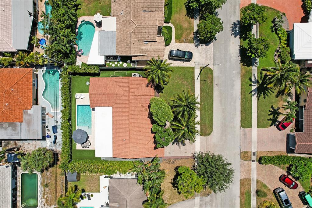 2185 Northeast 61st Court Fort Lauderdale, FL 33308 - Photo 3 of 49 an aerial view of a house with a yard and garden