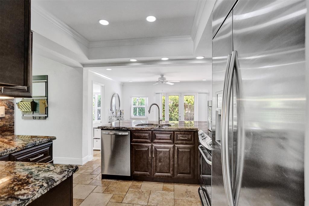 2185 Northeast 61st Court Fort Lauderdale, FL 33308 - Photo 33 of 49 a kitchen with stainless steel appliances granite countertop a sink and a stove