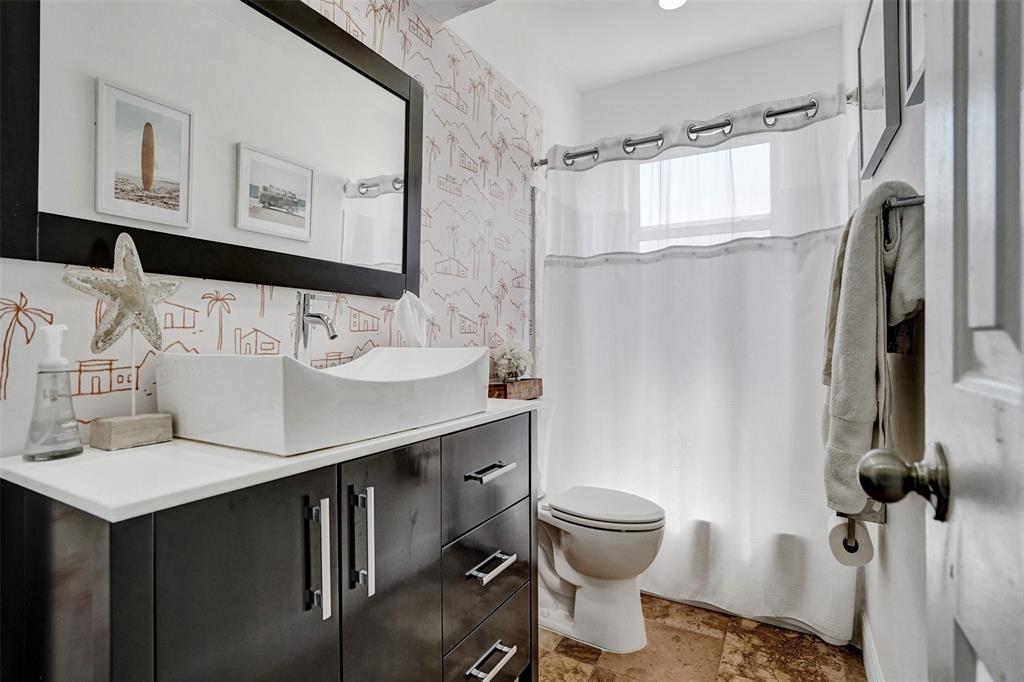 2185 Northeast 61st Court Fort Lauderdale, FL 33308 - Photo 36 of 49 a bathroom with a sink toilet and shower
