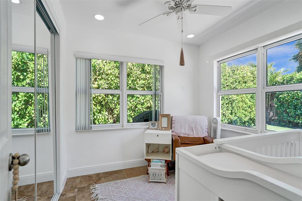 2185 Northeast 61st Court Fort Lauderdale, FL 33308 - Photo 38 of 49 a bedroom with a bed and a window