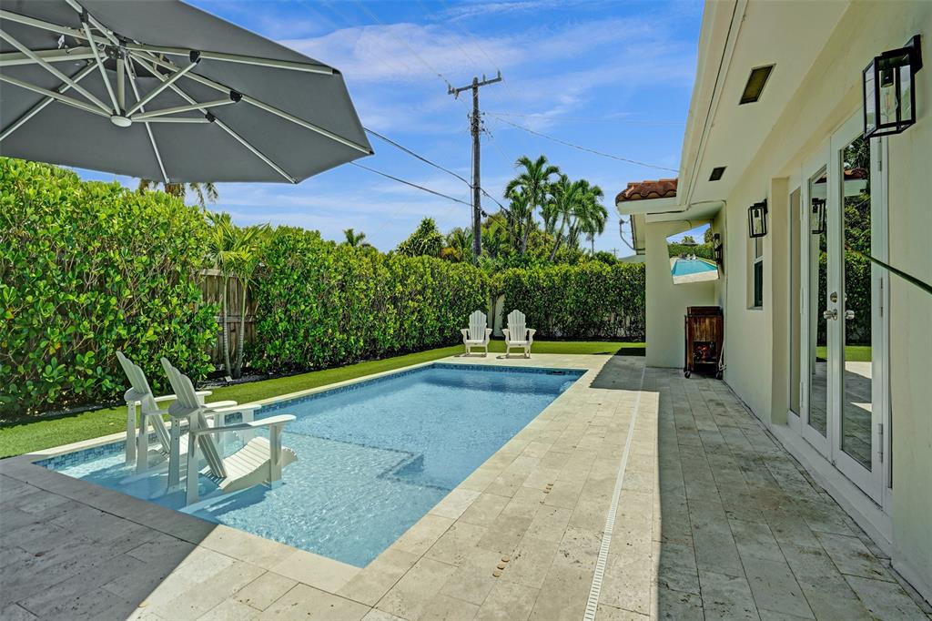 2185 Northeast 61st Court Fort Lauderdale, FL 33308 - Photo 40 of 49 a view of a swimming pool with a patio