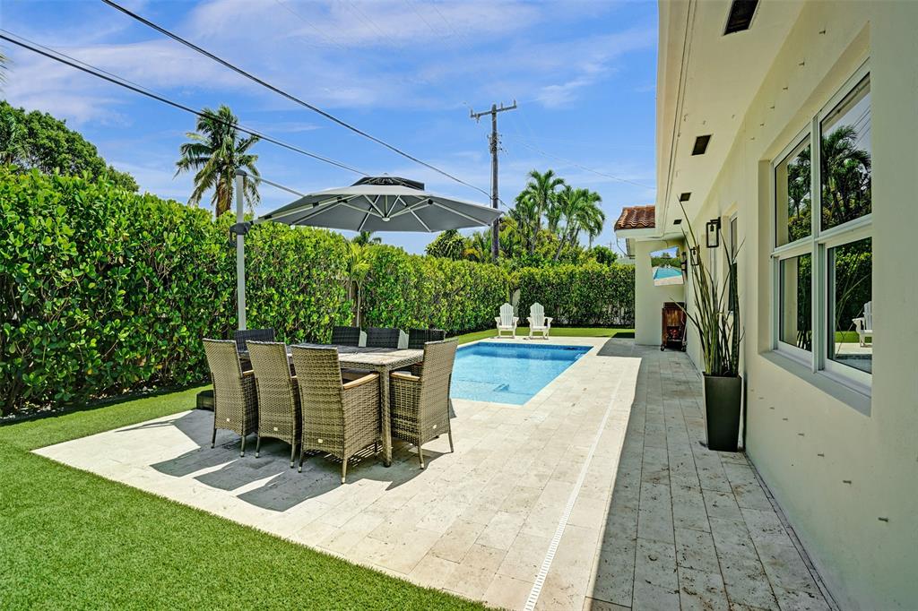 2185 Northeast 61st Court Fort Lauderdale, FL 33308 - Photo 41 of 49 a view of a swimming pool with seating space