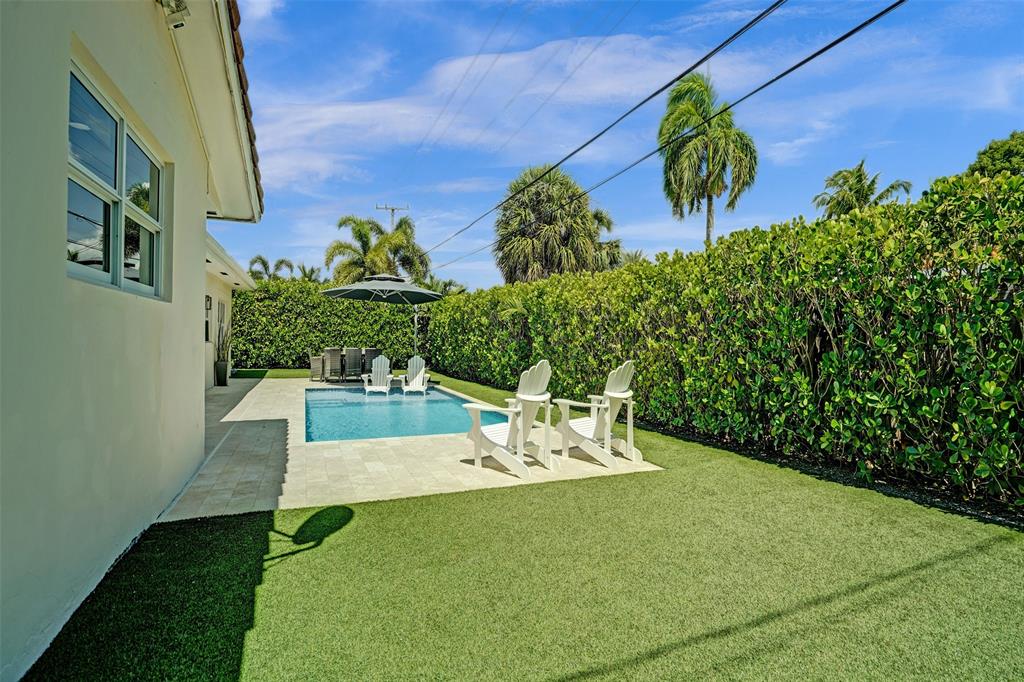 2185 Northeast 61st Court Fort Lauderdale, FL 33308 - Photo 45 of 49 a view of a table and chairs in patio of the house