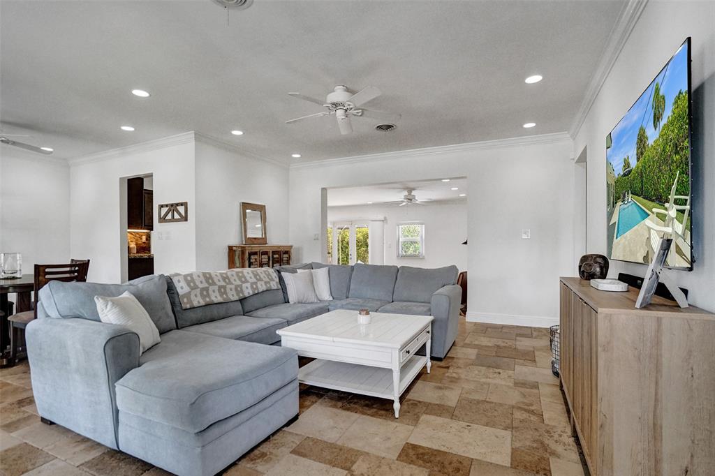 2185 Northeast 61st Court Fort Lauderdale, FL 33308 - Photo 5 of 49 a living room with furniture and a flat screen tv